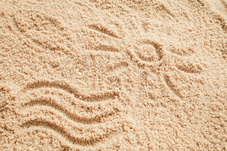 drawing on the sand by the sea travel background