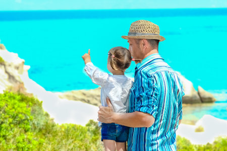 happy parent with child by the sea greece outdoorsの写真素材