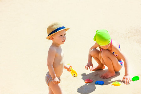Happy child playing on the sea backgroundの写真素材