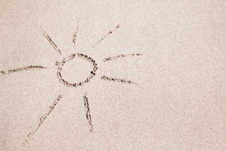 Beautiful drawing on the sand of the sea backgroundの写真素材