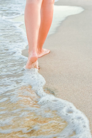 stylish beautiful legs with traces of the sea in the summer on the natureの写真素材