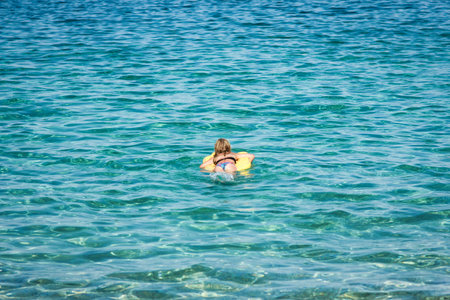happy child playing at sea in greeceの写真素材