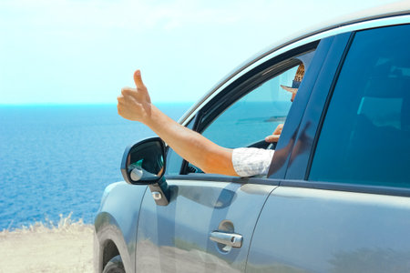 happy guy in auto sea backgroundの写真素材
