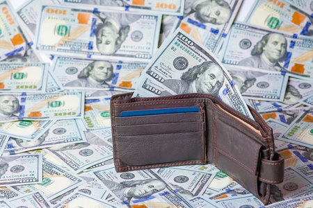 money in wallet on the background of dollars the concept of a pandemicの写真素材