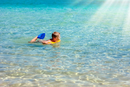 Happy child by the sea in nature in the park journeyの写真素材
