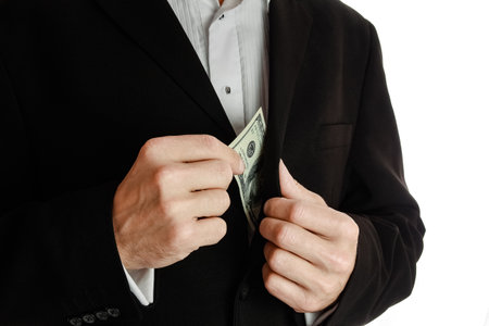 Business man holding money on white backgroundの写真素材