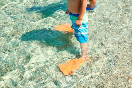 Happy child by the sea in nature in the park journeyの写真素材