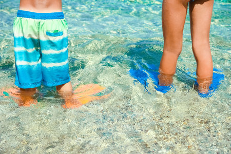 Happy child by the sea in nature in the park journeyの写真素材