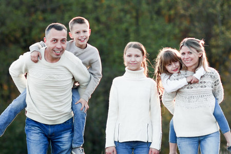 happy family walking in the park in autumn concept together happiness