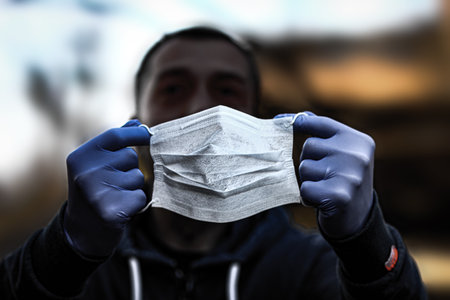 masked man from coronavirus and air. Protection against PM 2.5 air polluted from the virus in Europe and Asiaの写真素材