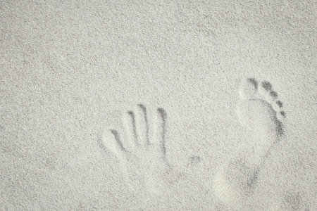 drawing on the sand by the sea travel backgroundの写真素材