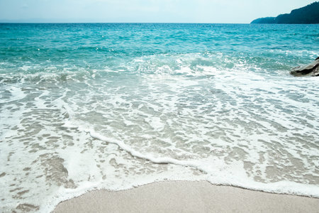 Beautiful sea and sand on the shore vacation travel backgroundの写真素材