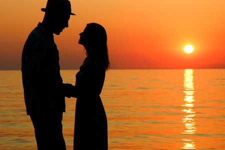 happy couple by the sea in nature silhouette weekend travelの写真素材