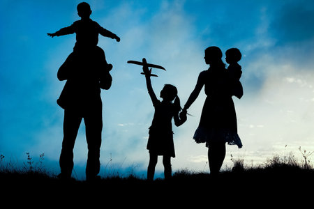 happy family by the sea on nature silhouette backgroundの写真素材