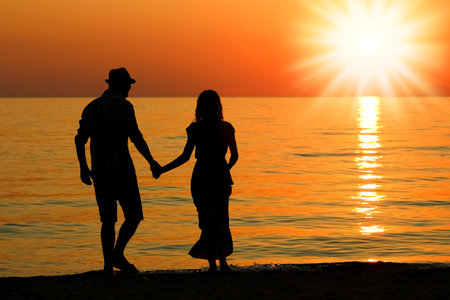 happy couple by the sea in nature silhouette weekend travelの写真素材