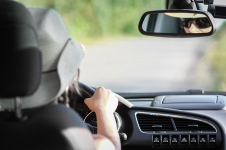 driver driving a car on the roadの写真素材