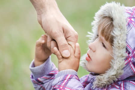 hands Happy parents and child outdoors in the parkの写真素材