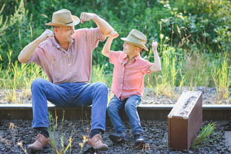 father and son cowboys concept happiness togetherの写真素材