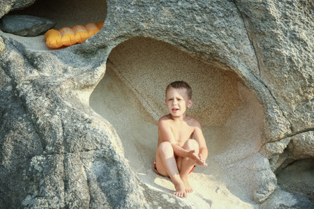 happy child playing by the sea