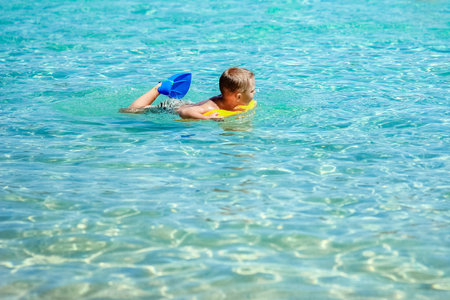 Happy child by the sea in nature in the park journeyの写真素材