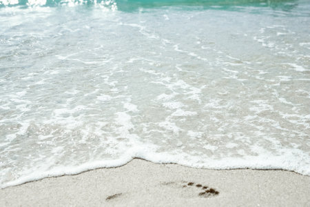 Beautiful sea and sand on the shore vacation travel backgroundの写真素材