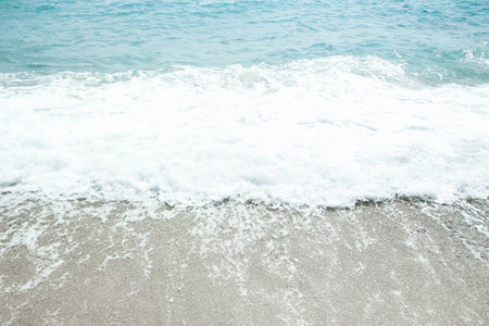 Beautiful sea and sand on the shore vacation travel backgroundの写真素材