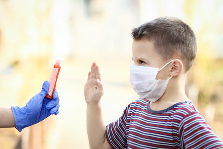 Coronavirus and air pollution PM2.5 concept. European little boy wearing mask for protect pm2.5 and...