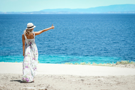 Happy girl near the seashore in nature weekend travelの写真素材