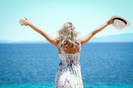 Happy girl near the seashore in nature weekend travelの写真素材