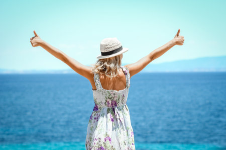 Happy girl near the seashore in nature weekend travelの写真素材