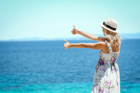 Happy girl near the seashore in nature weekend travelの写真素材