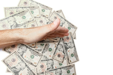 Money dollars in the hands on a white backgroundの写真素材