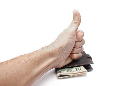 Dollars money in your wallet and hands on a white backgroundの写真素材