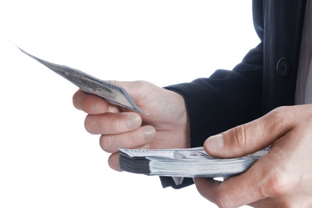 Business man holding money on white backgroundの写真素材