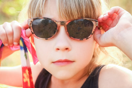 emotions of a child in nature concept in the parkの写真素材