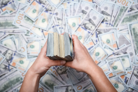 Dollars in the hands of a businessman man guy for a trip to the rest of the shopsの写真素材