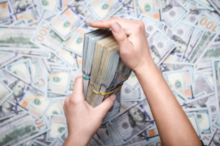 Dollars in the hands of a businessman man guy for a trip to the rest of the shopsの写真素材