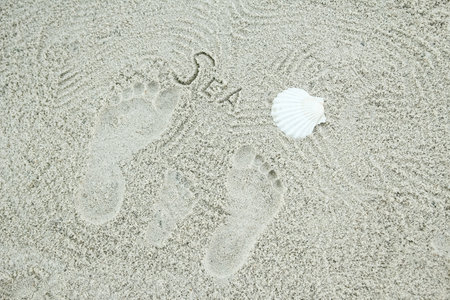 beautiful pattern on the sea sand on nature backgroundの写真素材