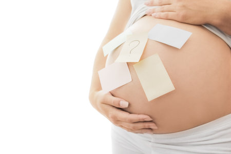 Pregnant girl on white background with stickersの写真素材