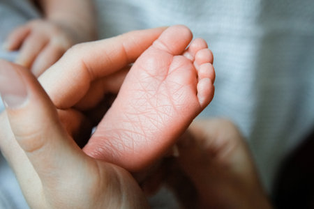 Happy baby hand and parent's backgroundの写真素材
