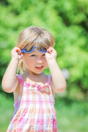 happy child having fun playing in the nature parkの写真素材