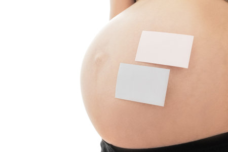 Pregnant girl on white background with stickersの写真素材