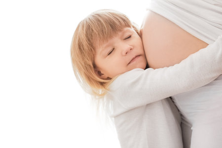 pregnant girl on a white background with babyの写真素材
