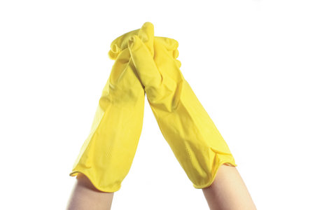 hands in gloves washing dishesの写真素材