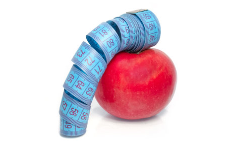 Apple roll with meter on white backgroundの写真素材