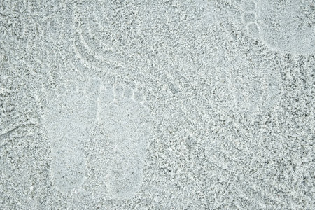 beautiful pattern on the sea sand on nature backgroundの写真素材