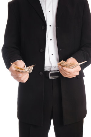 Business man holding money on white backgroundの写真素材