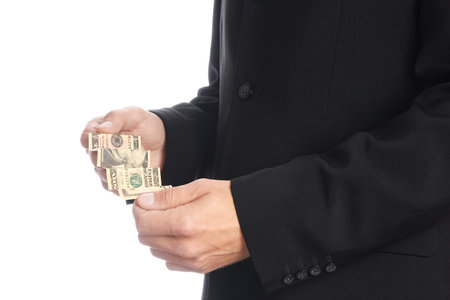 Business man holding money on white backgroundの写真素材