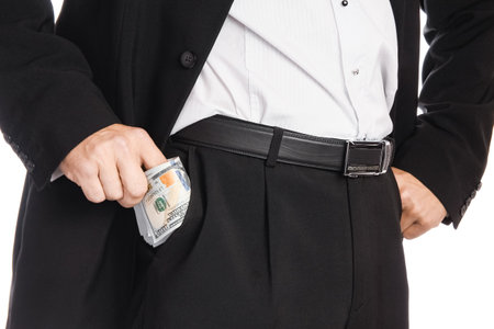 Business man holding money on white backgroundの写真素材