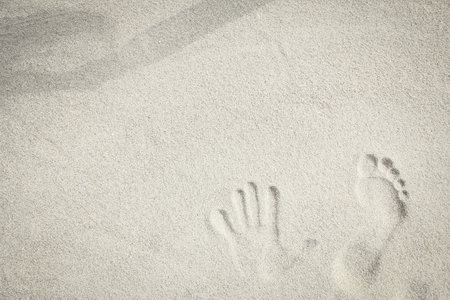 drawing on the sand by the sea travel backgroundの写真素材